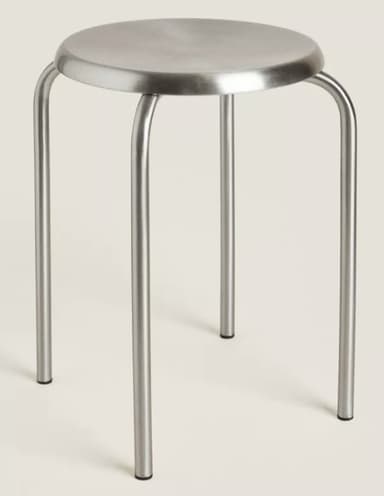 A simple, round-seated stool with four curved metal legs, featuring a minimalist and industrial design. — 3D model