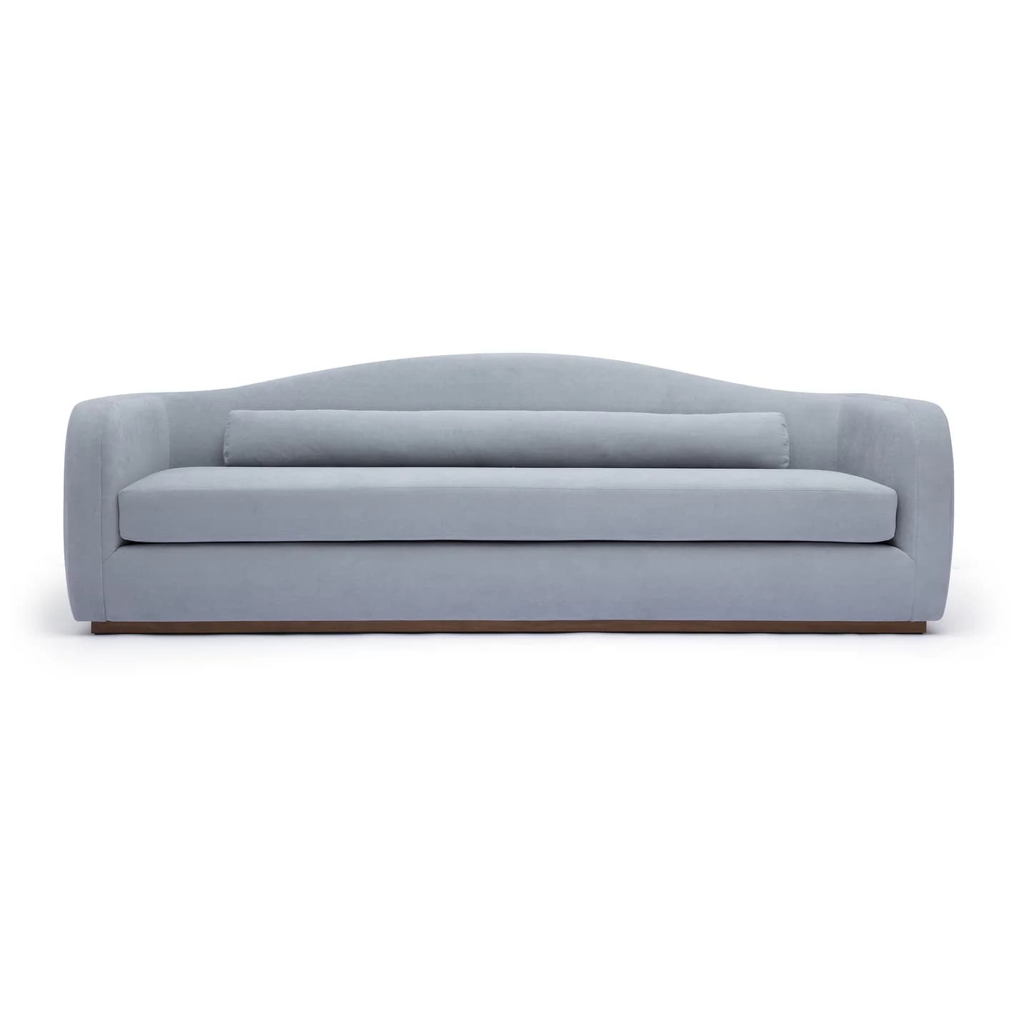 A modern upholstered sofa in a light blue color, featuring a subtly curved backrest, rounded track arms, a single seat cushion, and a prominent bolster cushion, all resting on a recessed plinth base. — 3D model