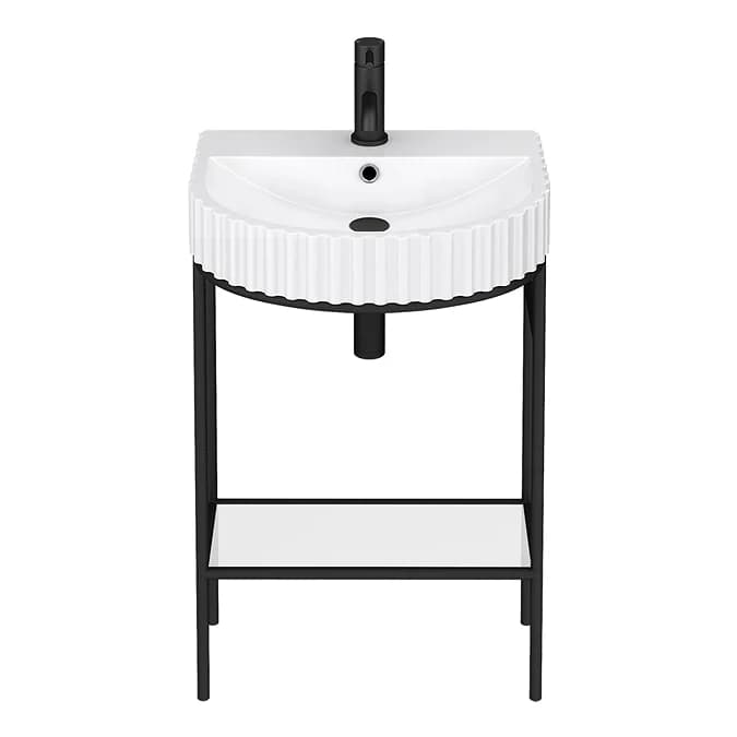 A modern freestanding bathroom vanity featuring a white ceramic basin with a distinctive fluted exterior, supported by a minimalist black metal frame. It includes a matte black single-hole faucet and an integrated lower shelf. — 3D model