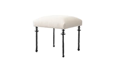 A decorative stool featuring a semi-circular upholstered seat and four slender, sculpted dark metal legs. The cushion is covered in a light, textured fabric, likely off-white or cream. The legs are dark, possibly wrought iron, and exhibit intricate, organic detailing with stacked ring-like elements near the seat attachment and a textured, gnarled appearance along the shafts. The overall design suggests an elegant, somewhat traditional or rustic-chic aesthetic. — 3D model