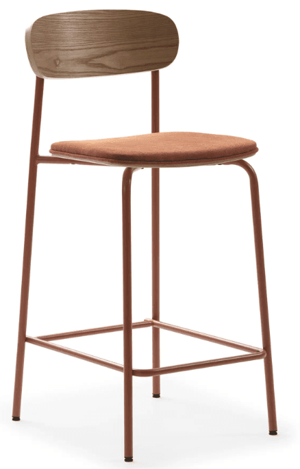 A modern bar stool featuring a slender, reddish-brown metal frame, a light wood backrest with rounded edges, and an upholstered, rectangular seat in a complementary terracotta fabric. The frame incorporates a square footrest for comfort. — 3D model