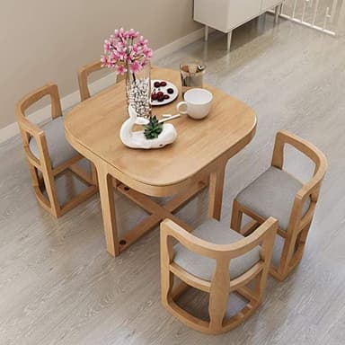 A compact modern dining set featuring a square wooden table with rounded corners and four matching chairs, each with a grey upholstered seat. The table has a distinctive X-shaped base for stability. The chairs feature curved, open-frame backs and integrated armrests, designed for small spaces. — 3D model