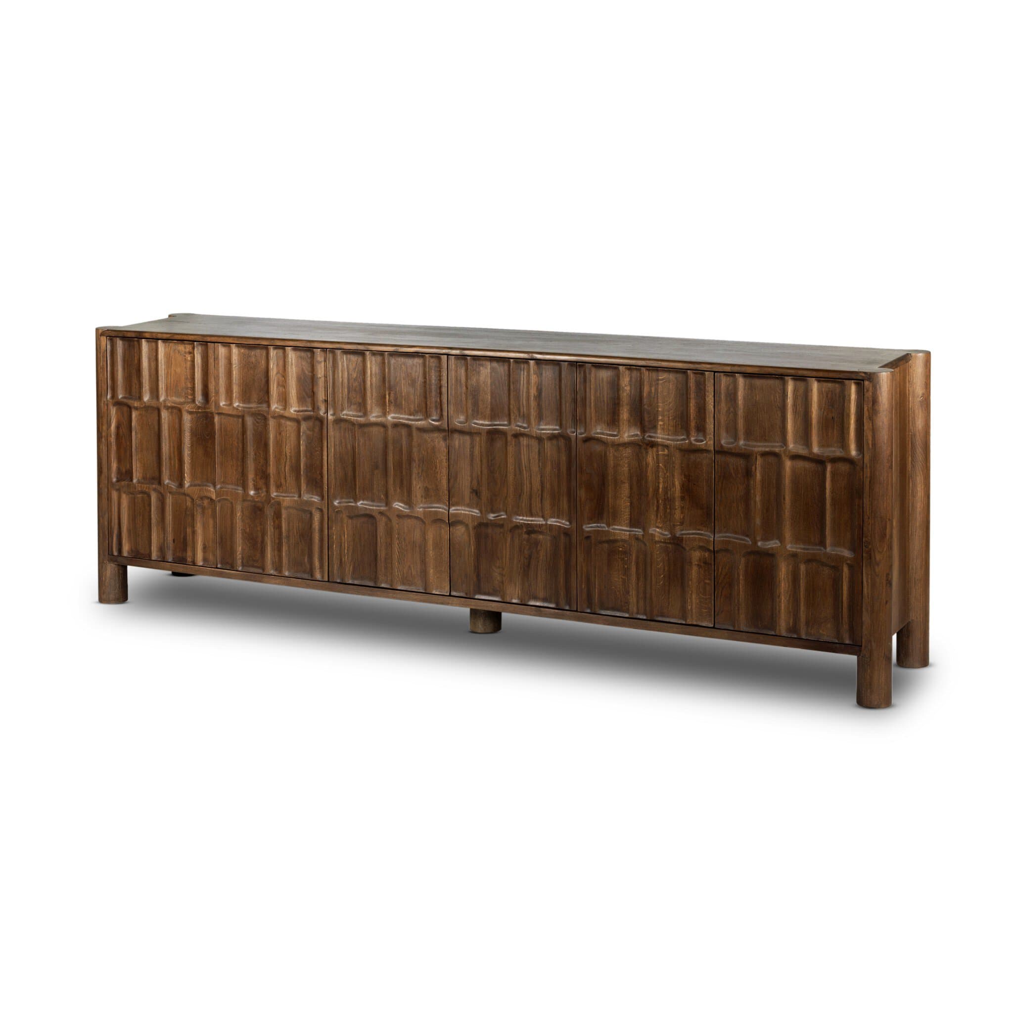A long, low wooden sideboard with a textured front featuring multiple vertical panels arranged in a geometric pattern. It is supported by four cylindrical legs. The top surface appears to be flat and smooth. — 3D model