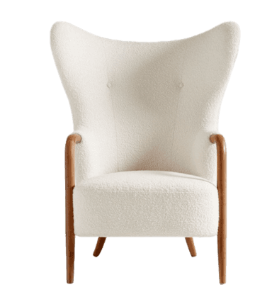A high-backed wingback armchair upholstered in a textured boucle fabric, featuring exposed curved wooden armrests and tapered wooden legs. — 3D model