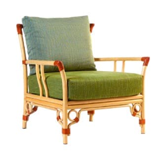 A light-colored rattan armchair with orange accents and green upholstered cushions. The chair features a woven cane back and seat, with cylindrical rattan legs and arms. A single square pillow is placed against the backrest. — 3D model