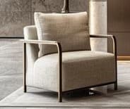 A modern armchair featuring a sleek, exposed metal frame and generously upholstered cushions. The frame has a metallic finish, likely bronze or champagne, forming the arms, legs, and back support. The seat and back cushions are covered in a light beige or off-white textured fabric, providing a clean and minimalist aesthetic. — 3D model