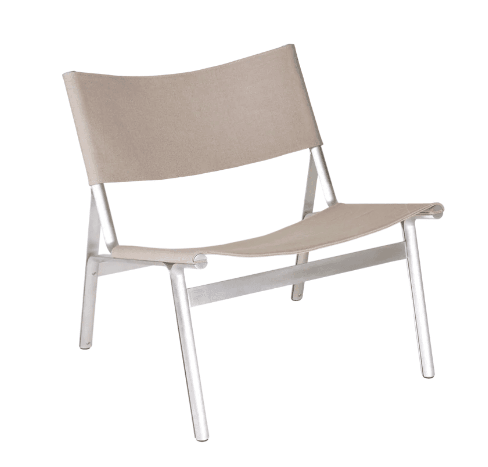 A contemporary lounge chair featuring a minimalist design with a brushed aluminum frame and a light beige fabric sling for the seat and backrest. The frame consists of slender, tubular components, forming a stable base and supporting the draped fabric. — 3D model