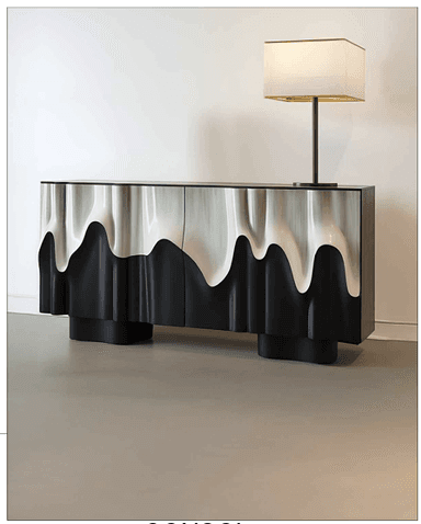 A contemporary sideboard featuring a distinctive wavy, 'melting' facade in contrasting metallic silver and matte black, with a flat black top and sides. — 3D model