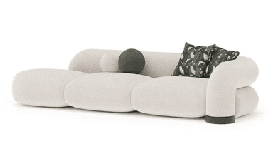 A contemporary curvilinear sofa featuring a low-profile, modular design upholstered in textured off-white bouclé fabric. The sofa comprises several rounded, pill-shaped segments that form the seat, backrest, and integrated armrests. It includes two square throw pillows with a dark green and off-white abstract pattern and one spherical solid dark green pillow. The base of the right armrest has a dark, possibly leather, accent band. — 3D model