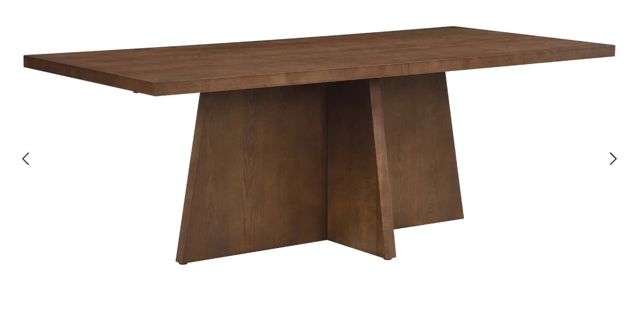A modern, rectangular dining table crafted from dark brown wood, featuring a thick tabletop and a distinctive sculptural pedestal base formed by intersecting angled panels. — 3D model