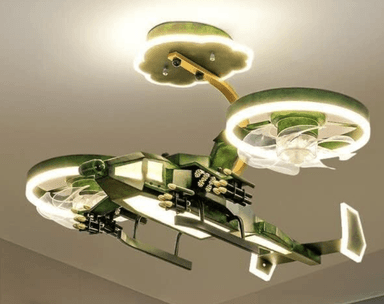 A modern, multi-arm LED chandelier with a distinctive sci-fi or futuristic aesthetic. It features a central angular body in green with gold-colored accents resembling mechanical components or weaponry. Two elongated arms extend horizontally, each ending in a ring of light, with additional translucent elements beneath that suggest thrusters or wings. The fixture is suspended by a golden rod from a scalloped, illuminated ceiling plate. The overall design evokes the appearance of a spaceship or advanced drone, set against a starry background. — 3D model