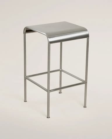 A minimalist, contemporary bar stool constructed from brushed metal, featuring a rectangular seat with subtly rounded edges and a four-legged base with an integrated footrest. — 3D model