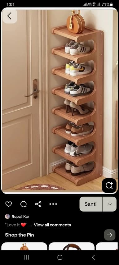 A tall, narrow, multi-tier shelving unit made of light-toned wood, featuring seven slanted shelves designed for storing shoes. The unit has an open-sided, minimalist design. — 3D model
