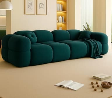 A modern, modular sofa featuring rounded, bubble-like upholstered sections in a deep teal color. The sofa consists of multiple individual soft modules forming the seat, backrest, and armrests, giving it a distinctive plush and inviting appearance. A small circular throw pillow is placed in the corner. — 3D model