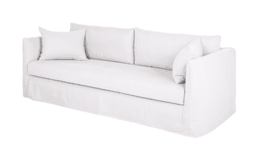 A white, slipcovered sofa featuring a skirted base, rolled arms, two large seat cushions, two back cushions, and two matching throw pillows. — 3D model