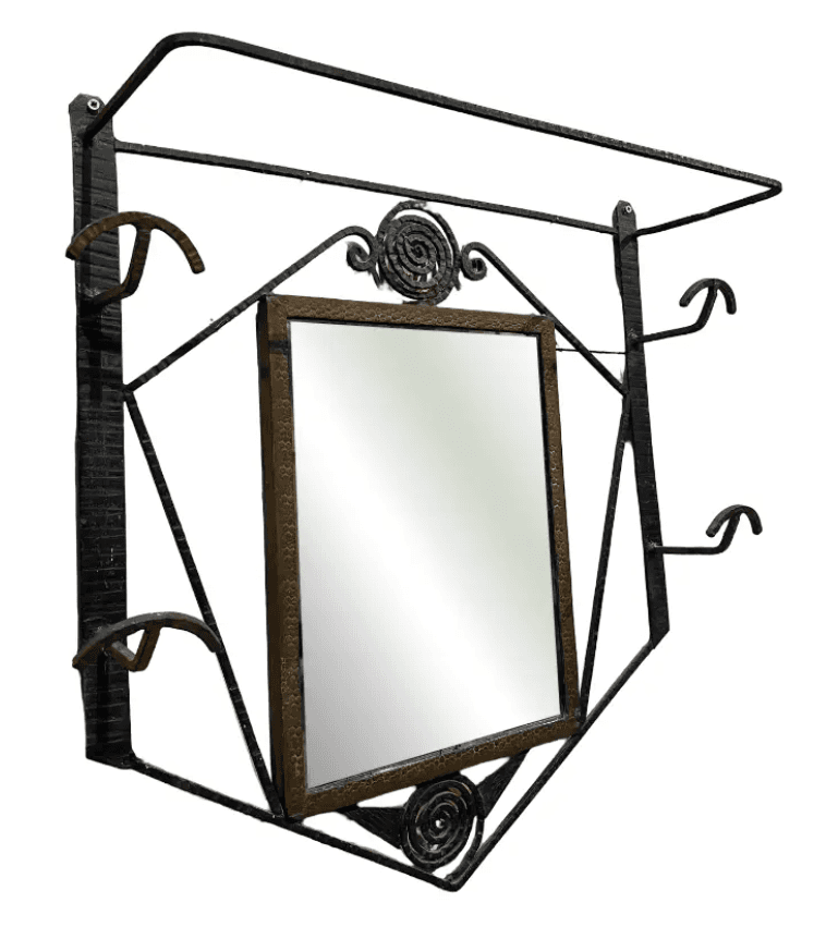 A vintage Art Deco wall-mounted hall tree crafted from forged iron, featuring an integrated rectangular mirror, multiple coat hooks, and an upper shelf. The iron frame exhibits geometric patterns and decorative scrollwork, finished in a dark, textured tone. The mirror is centrally placed within the ornate iron structure. — 3D model