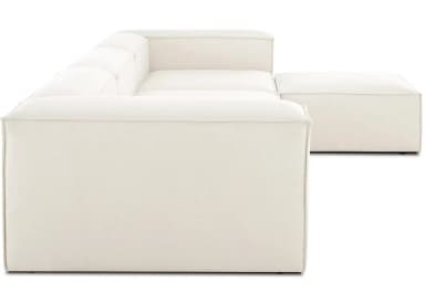 A cream-colored, modern modular sectional sofa, configured in an L-shape with a chaise lounge extension. The design features low-profile arms and backrests, with visible piping or top-stitching along all edges, indicating its modular construction with separate, upholstered blocks. — 3D model