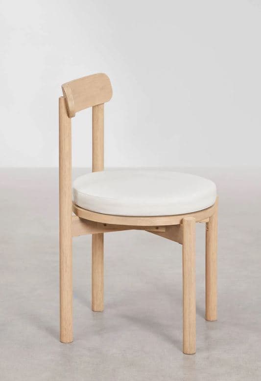 A minimalist wooden chair with a light-colored finish, featuring a round, white upholstered seat cushion and a small, curved wooden backrest. The chair stands on four straight, round legs. — 3D model