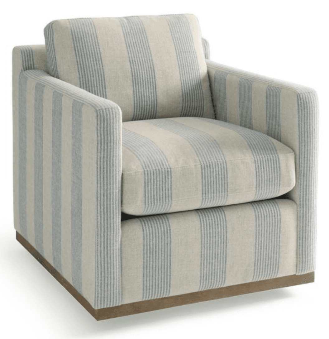 A striped armchair with thick upholstery and a squared-off design. It features a plush seat cushion and a separate back cushion. The base is a low-profile wooden plinth in a natural wood tone. The fabric has a textured weave with vertical stripes in a light blue and off-white color combination. — 3D model