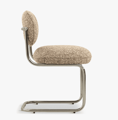 A modern accent chair featuring a cantilever base and upholstered seat and back. The frame is constructed from polished tubular metal, forming a cantilevered structure that supports the seat and backrest. The seat and backrest are generously padded and upholstered in a textured, speckled fabric. — 3D model