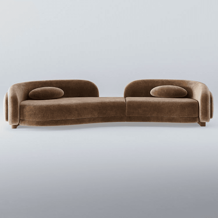 A modular sofa with a distinctive curved silhouette. The sofa is upholstered in a soft, textured fabric and features rounded armrests and backrests. It appears to be composed of two connected sections, creating an S-shaped seating arrangement. Two oval-shaped accent pillows are placed on the seating surface. The base of the sofa is low-profile, with small, rounded legs visible at the front. — 3D model