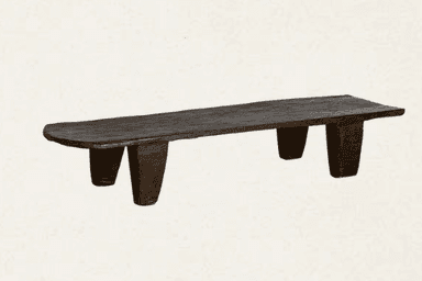 A rustic, dark wooden bench featuring an elongated, flat top and four sturdy, tapered legs. The material appears to be solid, roughly carved wood with a deeply aged or stained dark brown finish, presenting an organic and primitive aesthetic. — 3D model