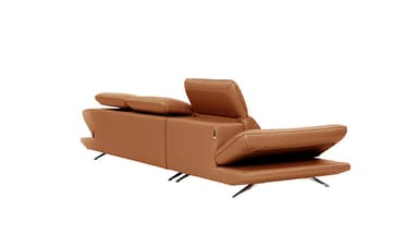 A modern, multi-seat sofa with a modular design. It features adjustable headrests and a chaise lounge component on the right side. The upholstery appears to be a smooth, matte leather, and the frame is supported by sleek, metallic legs. — 3D model
