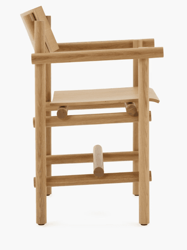 A wooden armchair with a minimalist and modern design. The chair features a curved backrest, a gently sloped seat, and armrests supported by cylindrical elements. The frame is constructed from solid wood with visible joinery, suggesting a focus on craftsmanship and natural materials. The legs are straight and supported by horizontal wooden pieces. — 3D model