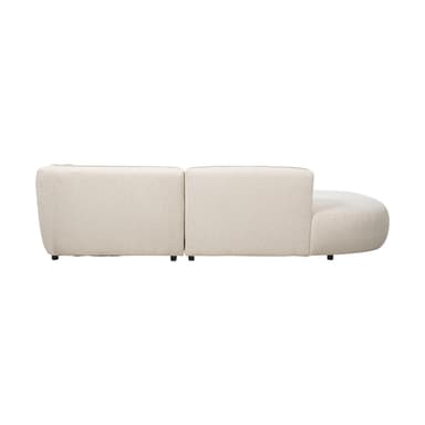 A modular sectional sofa with a curved, organic design. It features a plush, textured upholstery in a light cream or off-white color and sits on small, dark metal legs. The sofa appears to be composed of at least two sections, one with an extended chaise lounge. — 3D model