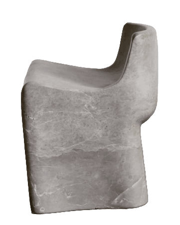 A monolithic accent chair crafted from a single block of natural travertine stone, featuring an organic, sculptural form with a distinctly contoured backrest and seat. The stone exhibits natural porosity and a light beige hue. — 3D model