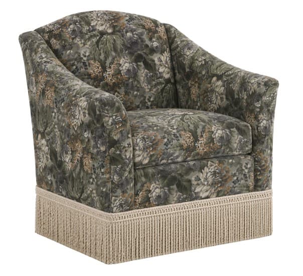 A fully upholstered armchair with a rounded back and arms, featuring a dense floral pattern in green, brown, and cream tones. The base of the armchair is adorned with a thick, beige fringe. The overall form suggests a classic or transitional style. — 3D model