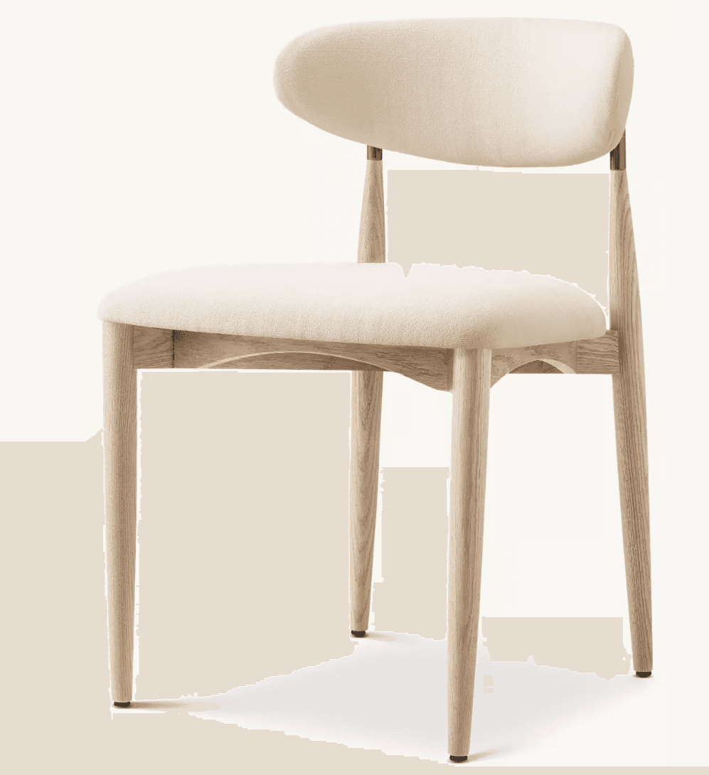 A modern dining chair with a cushioned seat and backrest, supported by a light-colored wooden frame. The chair features tapered legs and a gently curved back. The upholstery is a light, neutral fabric, and the wooden frame appears to be light oak. — 3D model