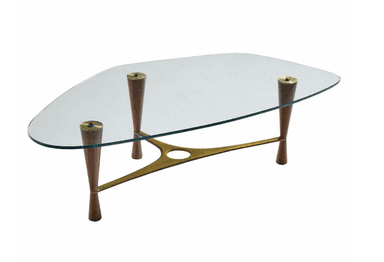 A glass-top coffee table with a distinctive mid-century modern design, featuring a sculptural brass frame and tapered wooden legs. — 3D model