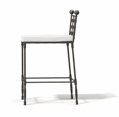 A tall bar stool featuring a dark wrought iron frame with a distinctive woven grid backrest and two spherical brass finials. The seat is cushioned and upholstered in a light-colored fabric, likely off-white or cream. The legs are slender, with some turned details towards the bottom, and include a square footrest for support. — 3D model