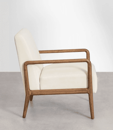 A close-up view of the base of an armchair, showing the junction of a cream-colored upholstered seat and a wooden frame. The wooden elements appear to be made of a light to medium-toned wood with visible grain, exhibiting a smooth, finished surface. The upholstery is subtly textured and features clean stitching lines. The overall design suggests a modern or mid-century modern aesthetic. — 3D model