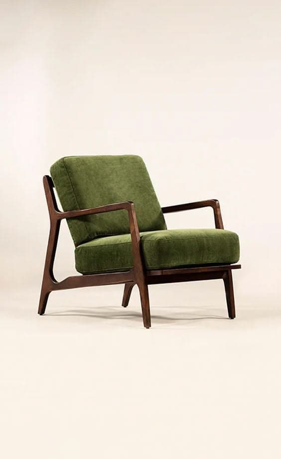 A stylish armchair featuring an exposed dark wood frame and comfortable olive green fabric upholstered cushions. The chair exhibits a mid-century modern aesthetic with clean lines, angled armrests, and slightly tapered legs. — 3D model