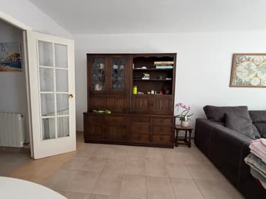 A traditional dark wood china cabinet, consisting of a hutch top with two sets of glass-paned double doors and a base with drawers and solid cabinet doors. The glass doors feature a decorative diamond-patterned mullion design, and the overall piece has a classic, elegant aesthetic. — 3D model