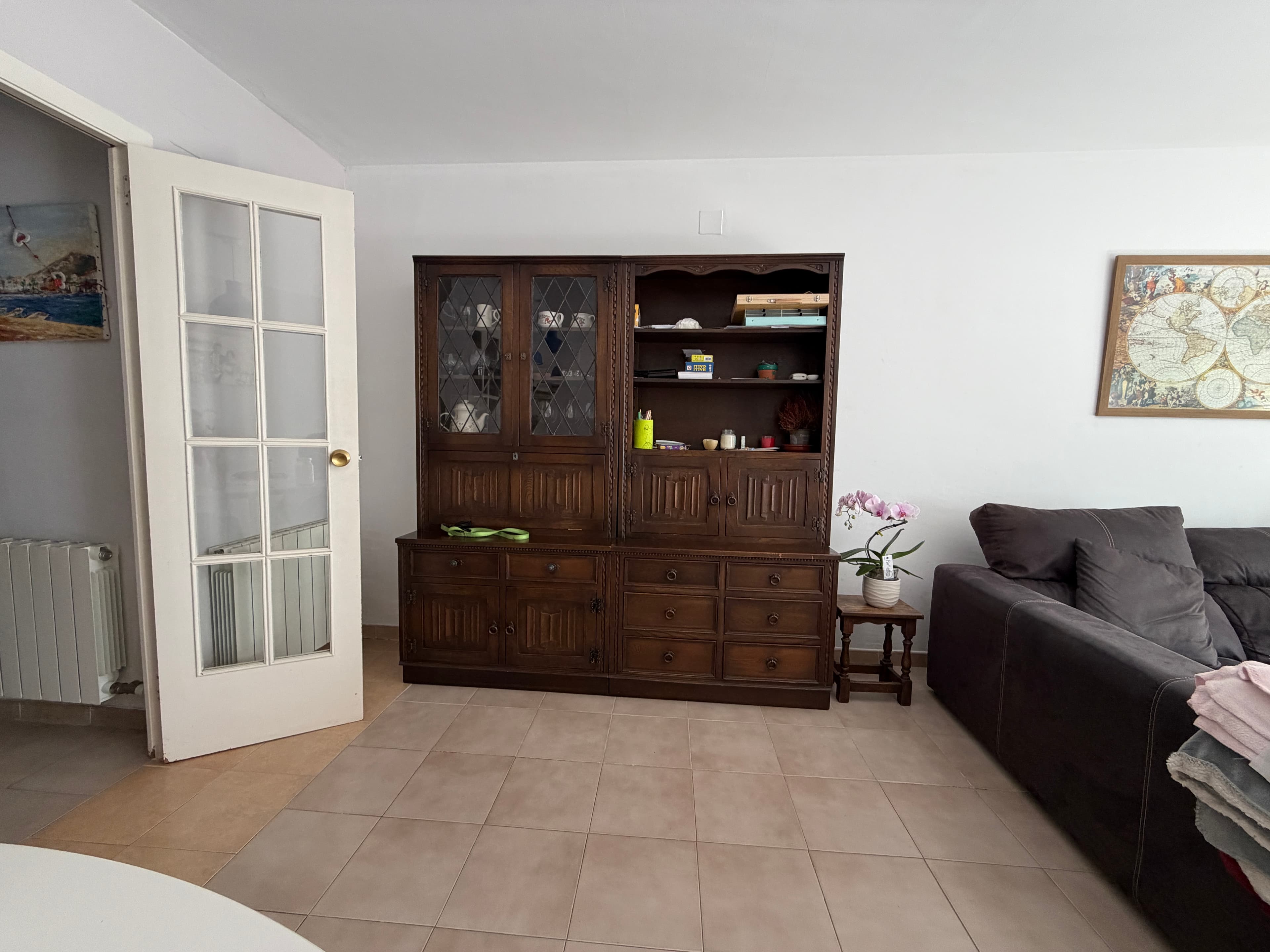 A traditional dark wood china cabinet, consisting of a hutch top with two sets of glass-paned double doors and a base with drawers and solid cabinet doors. The glass doors feature a decorative diamond-patterned mullion design, and the overall piece has a classic, elegant aesthetic. — 3D model
