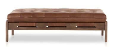A rectangular tufted ottoman with a dark wood frame and brown leather upholstery. The frame features a modern design with angular legs and horizontal supports. Leather straps are integrated into the frame to hold the cushion in place. The cushion is deeply tufted with visible stitching. — 3D model