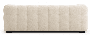 A modern three-seater sofa upholstered in a creamy, off-white boucle fabric. The sofa features a distinctive tufted design, creating a plush, segmented appearance across the backrest, seat, and arms. It has low, rounded arms and a solid, block-style base in black or dark brown, providing a contemporary aesthetic. — 3D model
