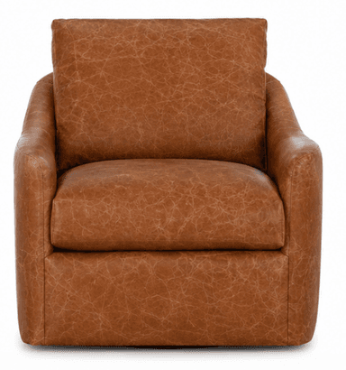 A modern upholstered armchair featuring a barrel-back design, covered in a rich, distressed cognac-colored leather. It includes a loose seat cushion and a matching loose back cushion, and is equipped with a hidden swivel base for rotational movement. — 3D model