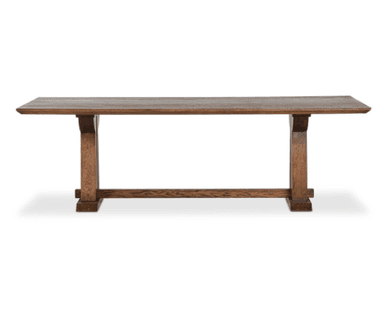 A long, rectangular wooden table with a sturdy, thick top and two trestle-style bases connected by a central stretcher. The wood has a visible grain and a dark, rich brown finish, suggesting a rustic or farmhouse aesthetic. The bases feature broad, vertical supports and wide, horizontal feet, providing a stable foundation. — 3D model