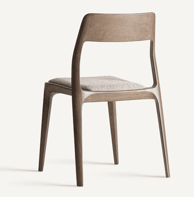 A modern dining chair constructed from dark-stained wood, featuring a curved backrest and a subtly upholstered seat. The chair exhibits a minimalist design with clean lines and tapered legs. — 3D model