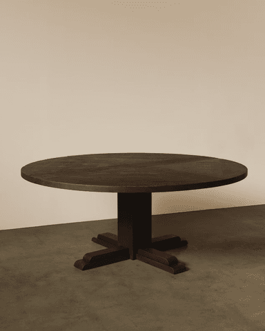 A round dining table crafted from dark stained wood, featuring a chevron pattern on its tabletop and supported by a central pedestal base with a cross-shaped foot. — 3D model