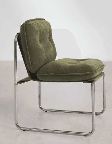 A modern cantilever chair featuring a continuous tubular chrome frame and light beige, textured bouclé-like fabric upholstery. The chair includes separate, plush seat and back cushions, with the backrest adorned with subtle button tufting. Its armless design and standard seat height make it suitable for dining or as an accent piece. Dimensions are provided, with an overall height of 87 cm and a seat height of approximately 50 cm. — 3D model
