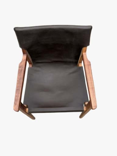 A modern armless chair with a dark wooden frame and a black sling-style upholstered back and seat, viewed from the rear. — 3D model