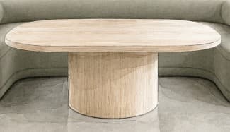 A minimalist oval coffee table made from light-toned wood, featuring a racetrack-shaped top supported by a single, sturdy cylindrical pedestal base. The wood grain is visibly consistent across both the top and the base. — 3D model