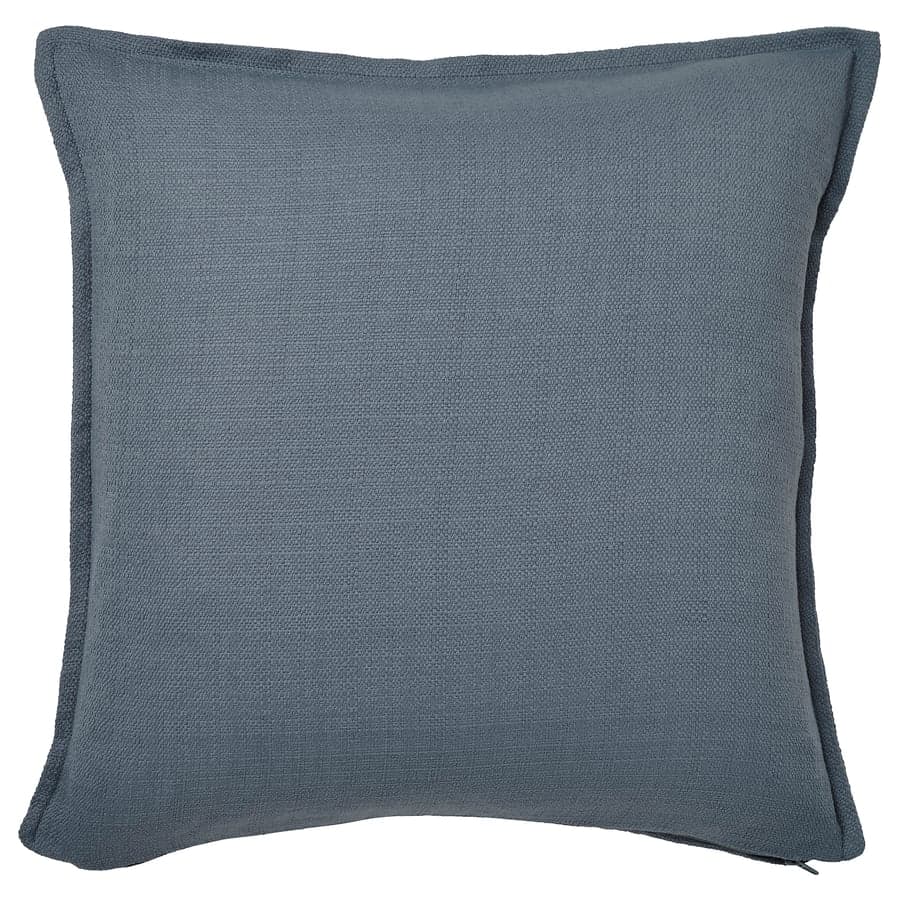 A square-shaped cushion with a textured fabric cover. The cushion has a visible piped edge along all sides. The fabric appears to be a woven material with a subtle slub texture. — 3D model