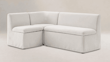 An L-shaped upholstered corner seating unit, consisting of multiple modules, featuring a light-colored fabric and clean, minimalist lines. — 3D model