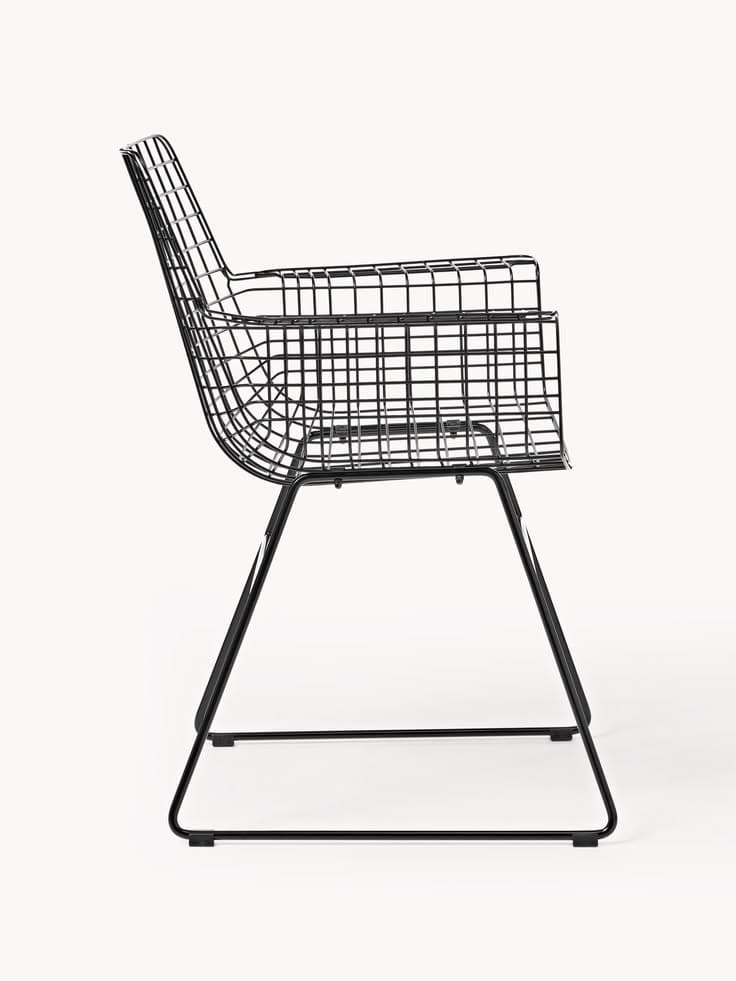 A modern black wireframe armchair featuring an open grid design for its seat, backrest, and integrated armrests. The chair is supported by a minimalist sled base made of tubular metal. — 3D model